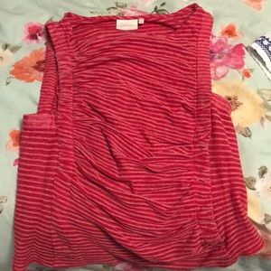 Red tank top. Form fitting and flattering